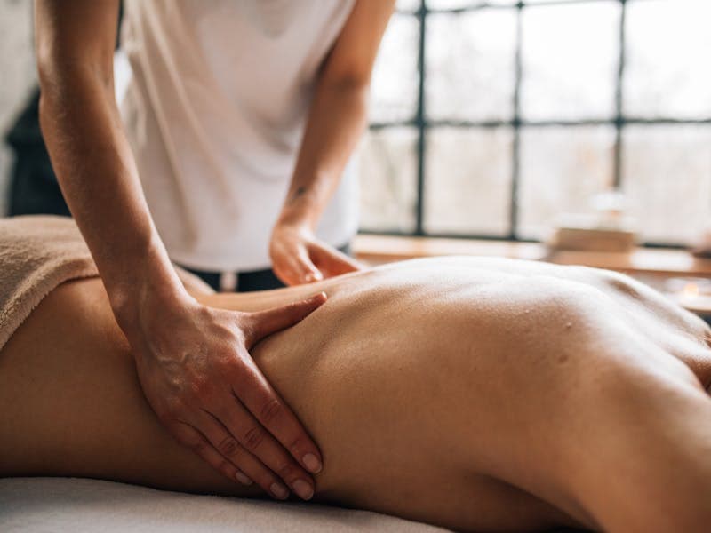 Therapist performing professional massage therapy on a client